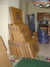 Packed mirror, picture, glass-top cartons stacked and ready to load