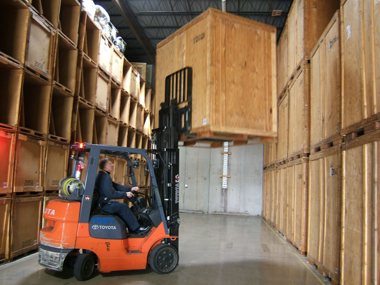 Putting a storage vault away into the warehouse