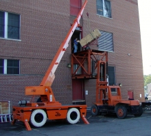 Moving and hoisting digital telephone equipment into a 2nd floor equipment entry door