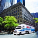 An Atlas Van Lines tractor-trailer in the city An Atlas Van Lines tractor-trailer in the city