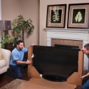 Atlas packers packing a big-screen television Atlas packers packing a big-screen television