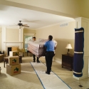 Carrying a sofa into the customer's residence