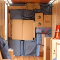 Household goods pad-wrapped and loaded on one of our trailers