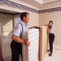 Packing a mattress into a sanitary mattress carton